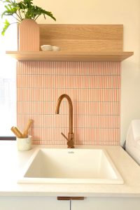 renovated laundry with pink Kit Kat tiles